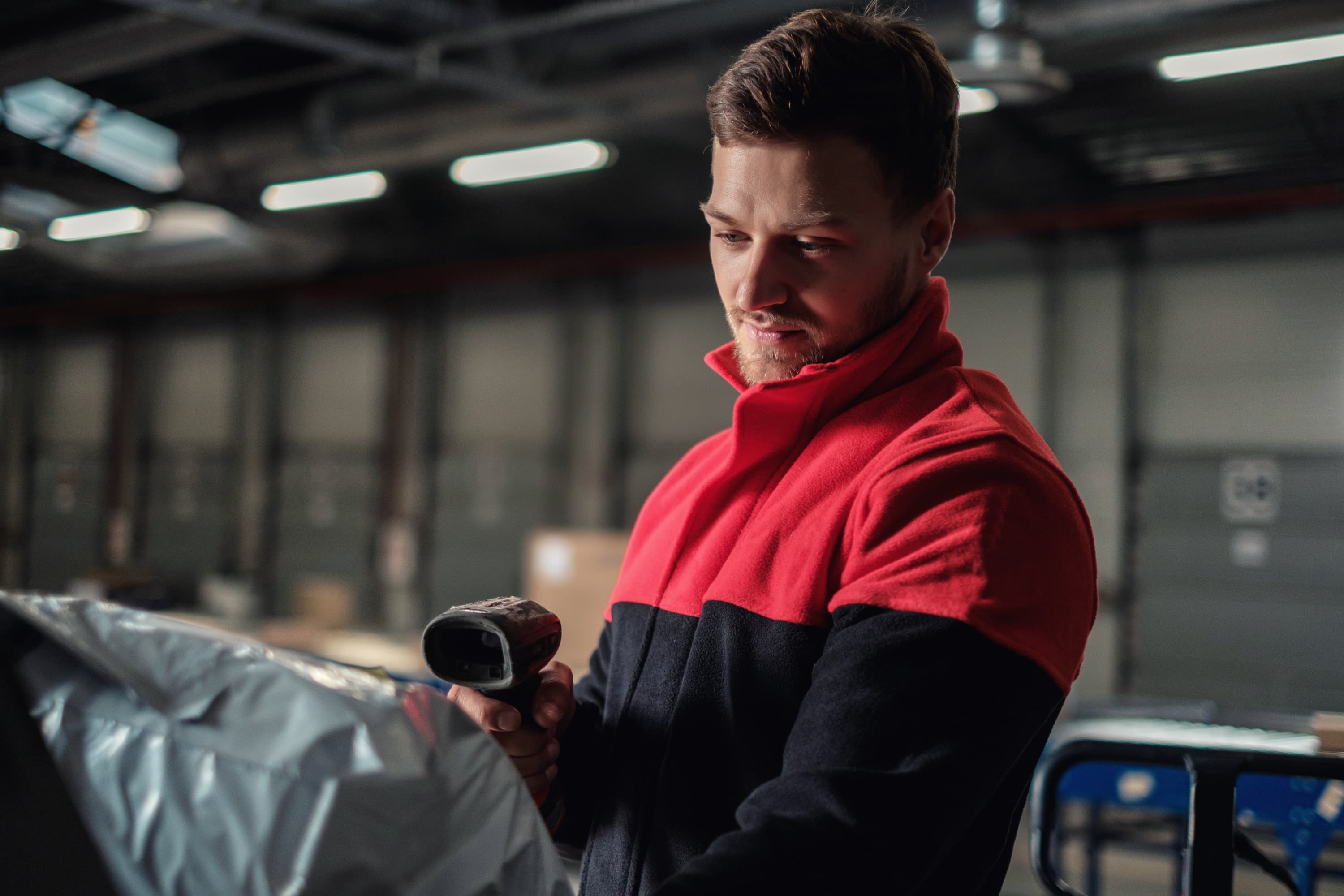 Operator scanning a barcode in a process area